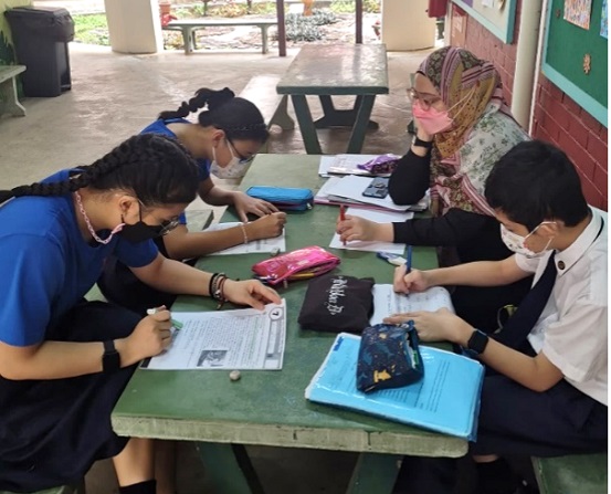 Teacher with students