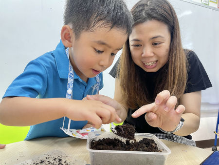 Kindergarten teacher and a student