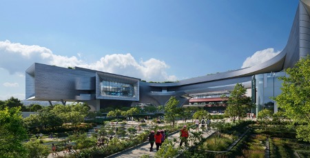 Lushly landscape plaza leding to the new Science Centre, with views of lake and greenery.